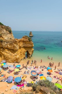 Tourists and bathers at the sandy beach