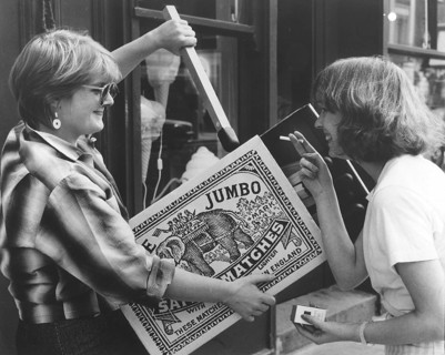 Two women with large matchbox