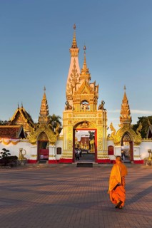 Monk in front of Chedi of Wat Phra That Phanom