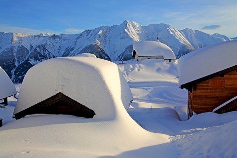 Snow-covered Maria zum Schnee chapel in the village centre