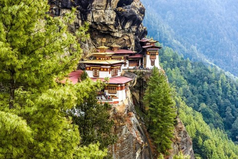 Buddhist tiger nest monastery Taktshang on steep rock face