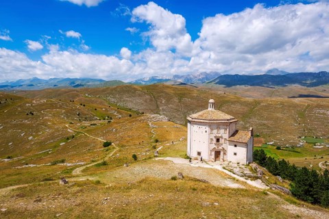 Church Santa Maria della Pieta with mountain massif Gran Sasso