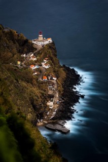 Lighthouse Farol da Ponta do Arnel with sea