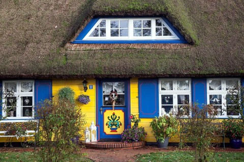 Typical yellow thatched-roof house