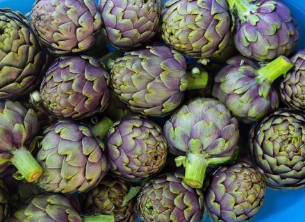 Fresh artichokes on plate