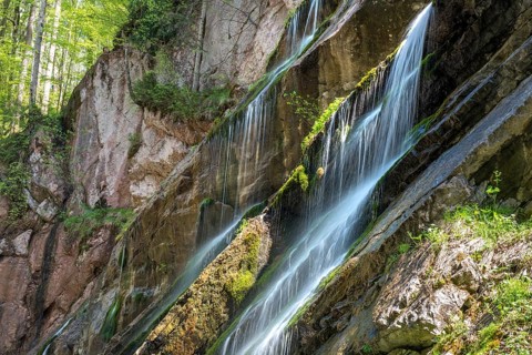 Waterfall on mossy slope