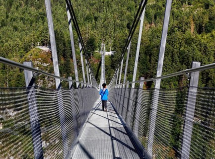 Child on suspension bridge Highline 179