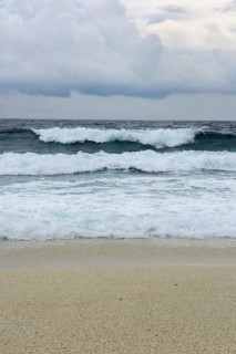 Storm and surf on the sandy beach