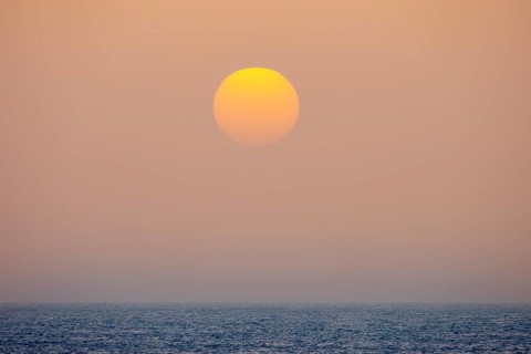 Sunset by sea fog