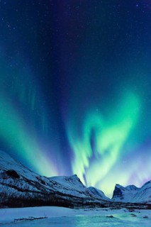 Northern Lights (Aurora borealis) over mountains