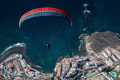 Paraglider over the Atlantic Ocean near La Caleta