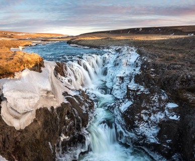 Waterfall with ice and snow in winter