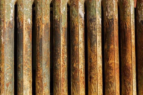 Close-up of rusted antique hot water heating radiator