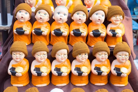 Monk toy puppets on display at the evening market