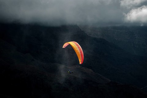 Paragliding over volcanic landscape