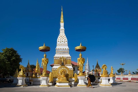 Chedi of Wat Mahathat Temple with Wheel of Life and golden Buddha figures