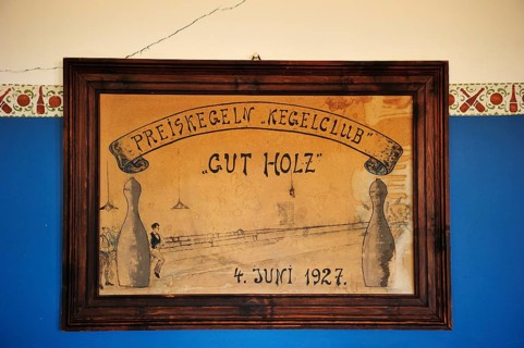 Shield of the former skittles club hanging on a wall in the former diamond town