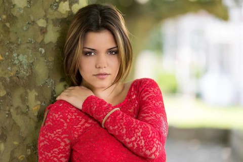 Young woman in red summer dress