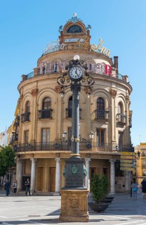 Round building El Gallo Azul with clock