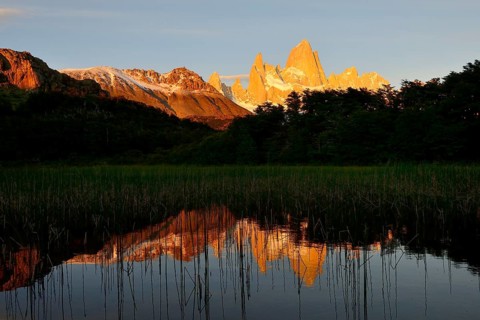 Mountain range with Cerro Fitz Roy at sunrise reflected in Lago de Los Tres