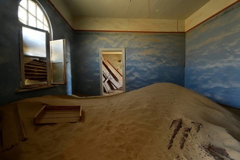 Desert sand in the ruined building of the former diamond city