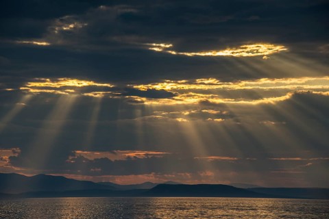 Sun breaking through the clouds above the Amur in Vladivostok