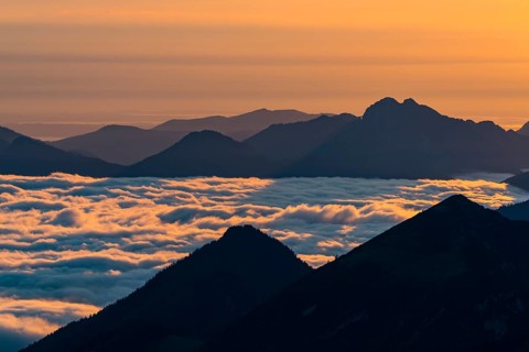 Mountain peak with sea of fog at sunrise