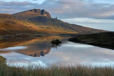 Rock formation of the Old Man of Storr with Loch Leathan