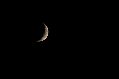 Crescent moon in the night sky