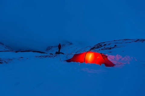 Tent with person in the snow