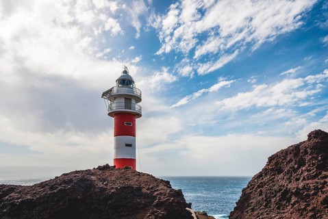 Rocky coast with lighthouse Punta de Teno