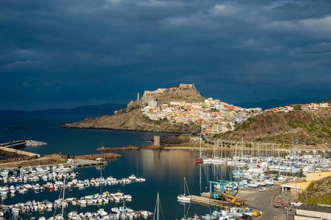 Dramatic light over the old town of Castelsardo with its boat harbour