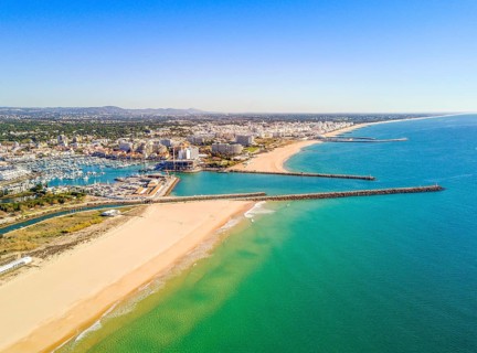 Aerial view marina and wide sandy beach