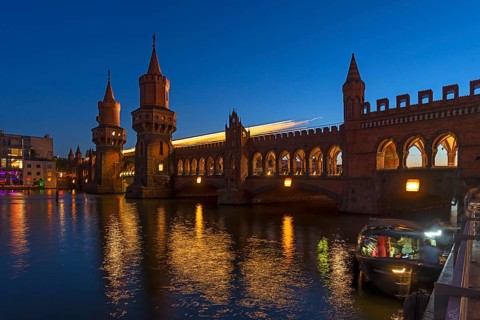 Oberbaum bridge with light traces of subway in evening light