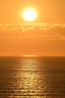 Sunset with cloud band over the North Sea