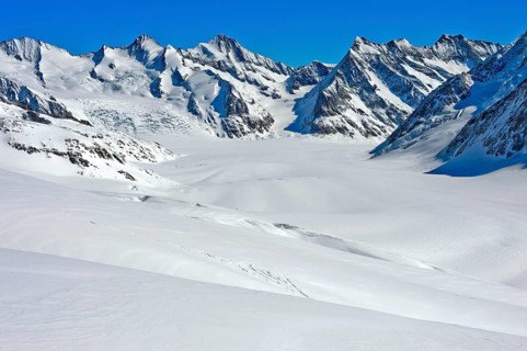 View from the Lotschenlucke over the snow-covered Grosser Aletschfirn towards Konkordiaplatz and the Bernese Alps
