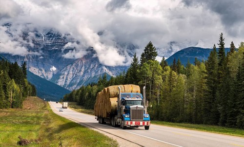 Truck loaded with straw bales on the Yellowhead Highway