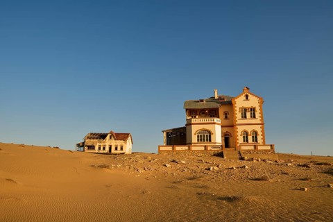 Decaying houses of the accountant and mine manager of the former diamond town Kolmanskop