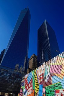 Building site with graffiti decorated walls in front of One World Trade Center Transportation Hub