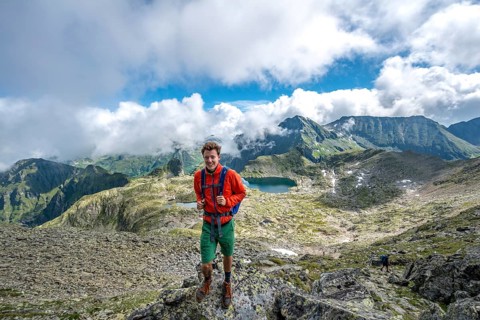Hiker on the summit of the Greifenberg