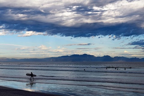 Surfers at the beach of Muizenberg