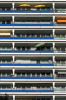 Detail of a high-rise facade with balconies on modernized prefabricated buildings