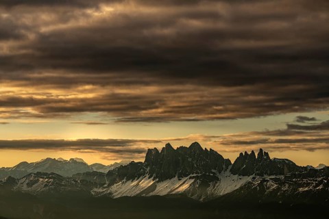 Sunrise with dramatic clouds over South Tyrolean mountain range