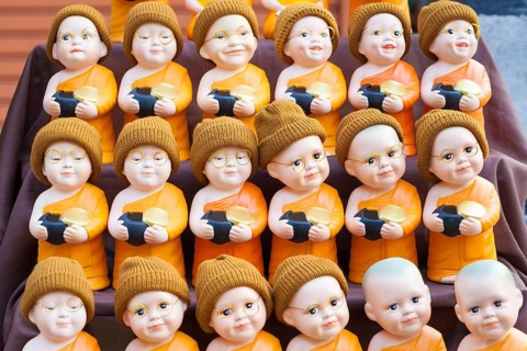 Monk toy puppets on display at the evening market