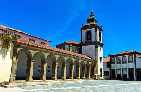 Arcade and clock tower on the central square of the Republic