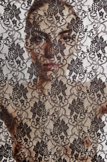 Nude woman behind a transparent cloth with floral pattern