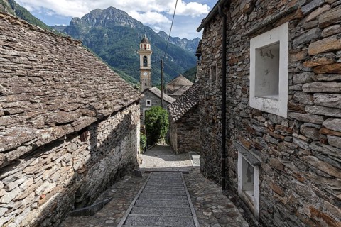 Typical Ticino stone houses and church in the village of Sonogno