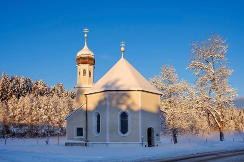 Snow-covered Nikolauskapelle in the morning light
