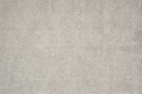 Surface of a medium gray rough plaster wall