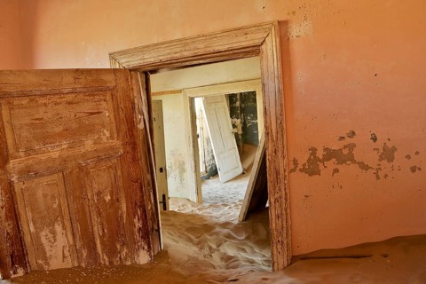 Desert sand in the ruined building of the former diamond city